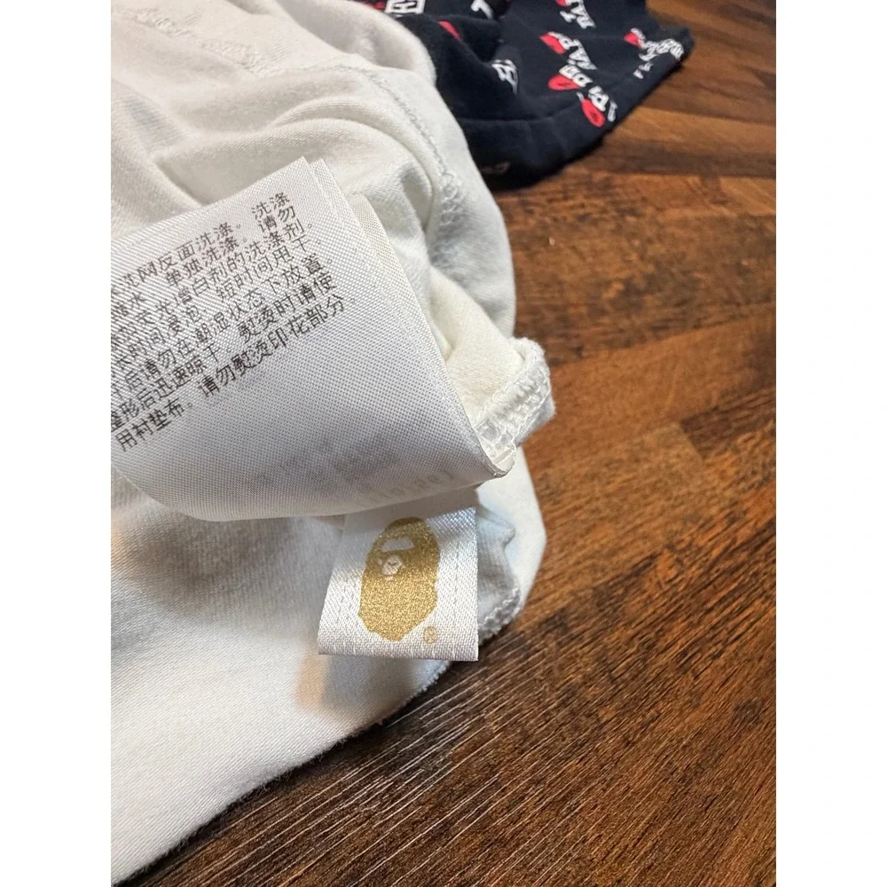 Bathing Ape BAPE kids raglan l/s shirt size 110. 2/3T. Patterned logo sleeves